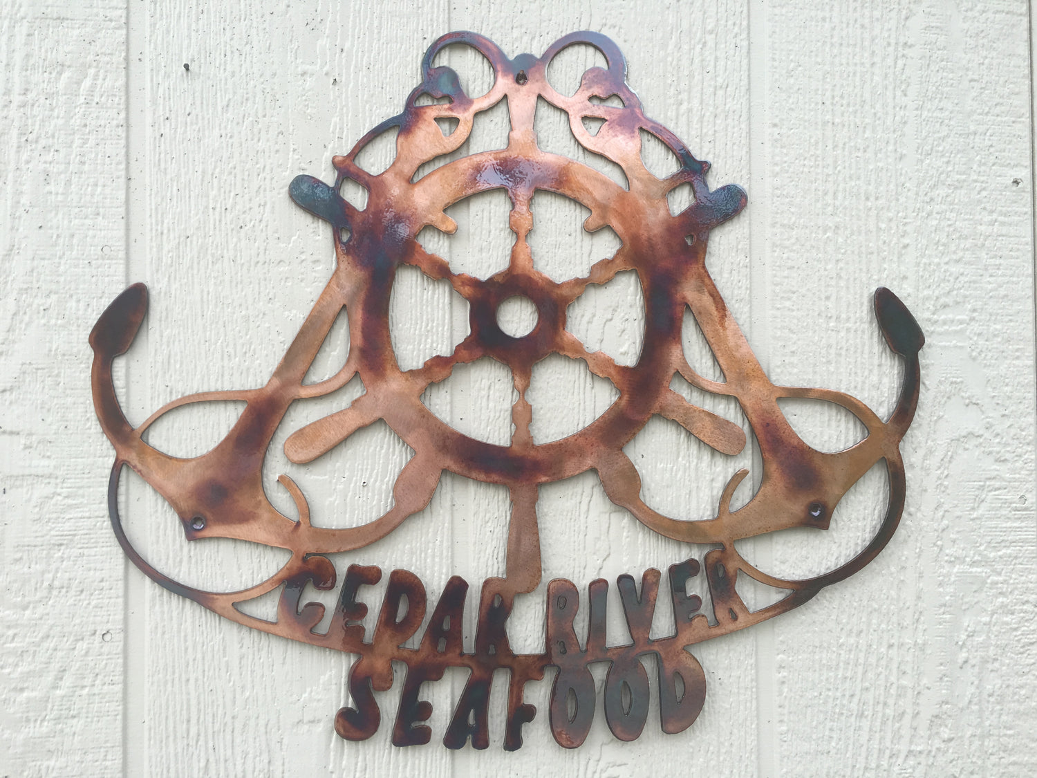 Crossed Anchors and ships wheel metal wall art