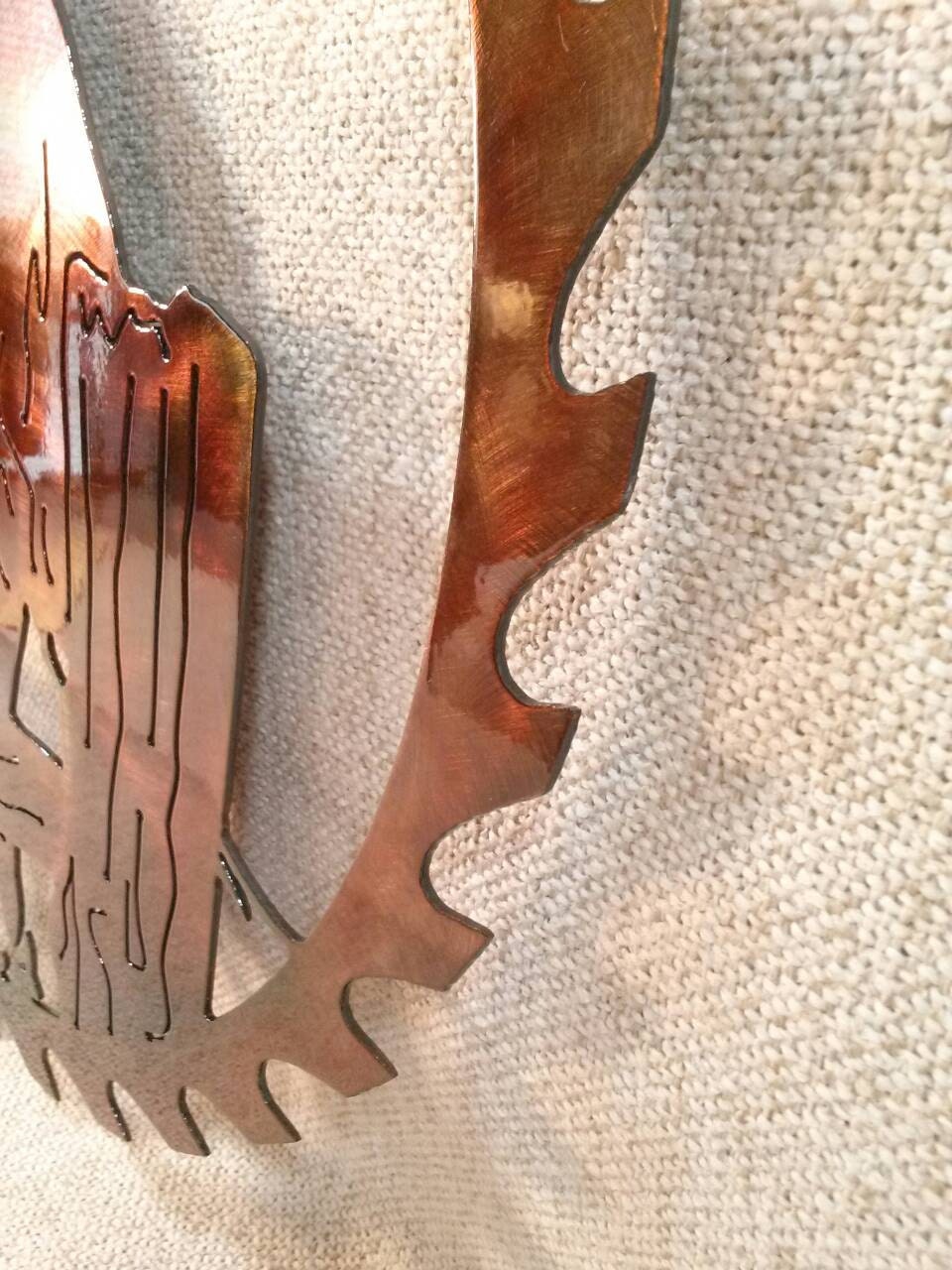 Side detail of whitetail buck metal wall art showing the circular saw blade edge, steel thickness, and hand-applied patina finish.