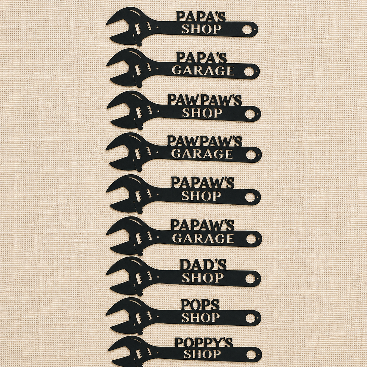 Nine black wrench-shaped signs with humorous dad-themed shop names are arranged in a vertical column on a beige linen-textured background.