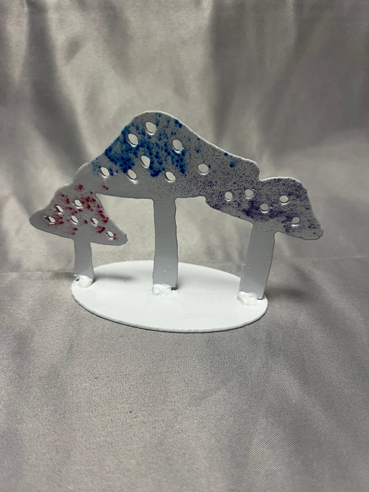 Front view of handmade colorful metal mushroom stand with white base