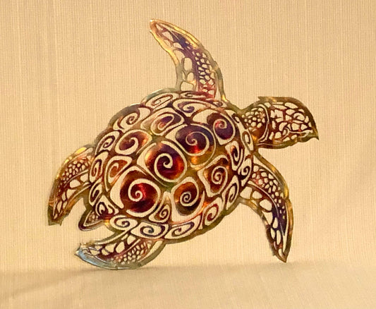 A plasma cut aquatic metal art piece depicting a sea turtle with flippers, finished with a patina and clear powder coat.