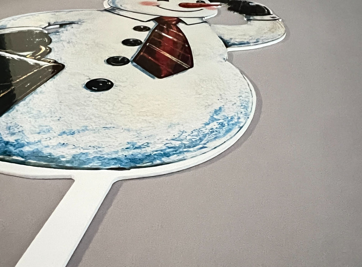 Close-up of snowman smiling face and top hat