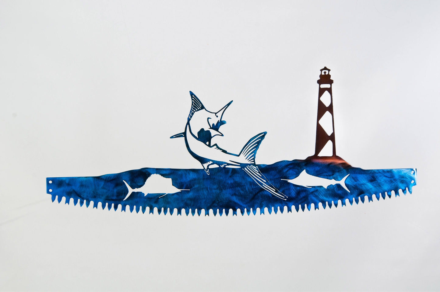 Blue Marlin and Cape Lookout Lighthouse metal wall art inside crosscut saw blade coastal fishing decor