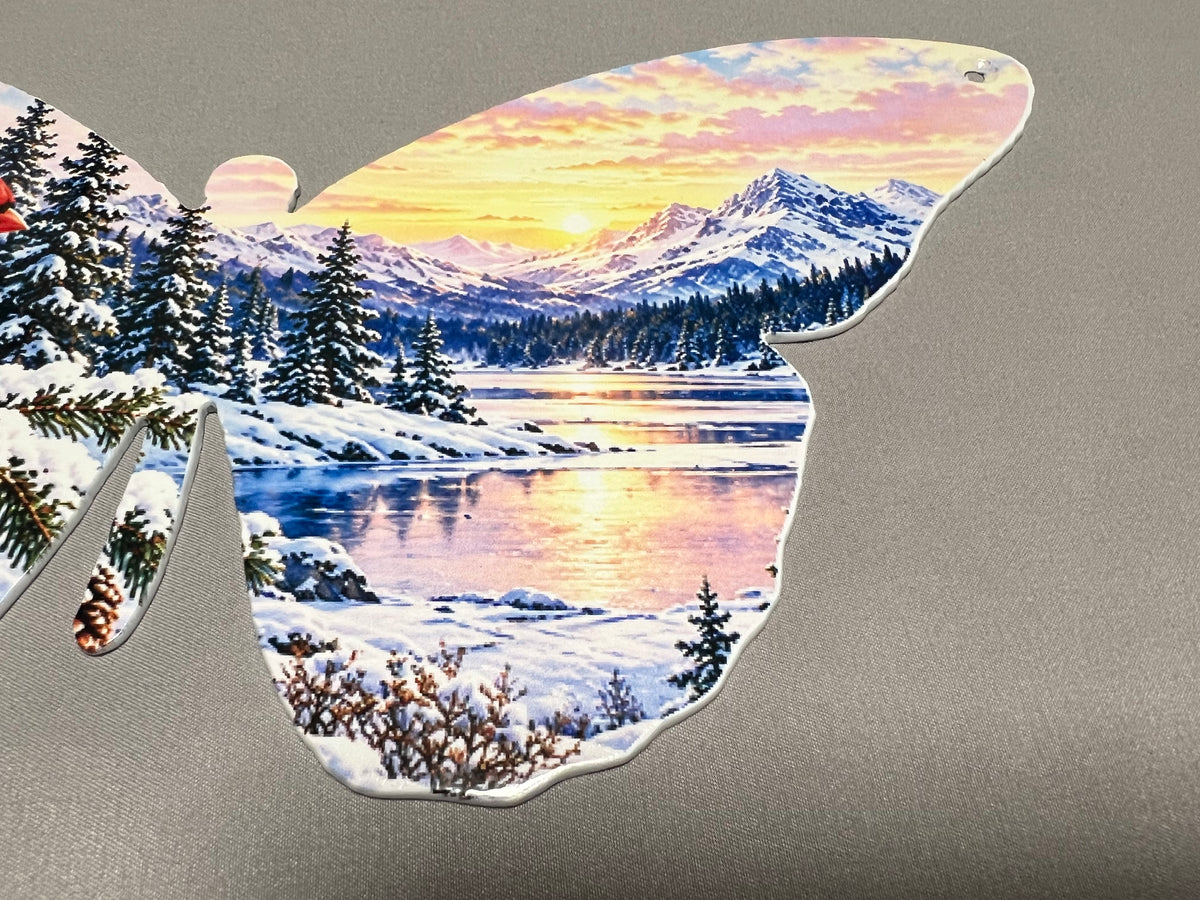 Center detail of the cardinal butterfly metal wall decor and winter landscape artwork.