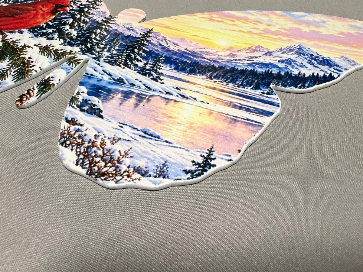Snowy mountain and winter sky detail on the butterfly wing.