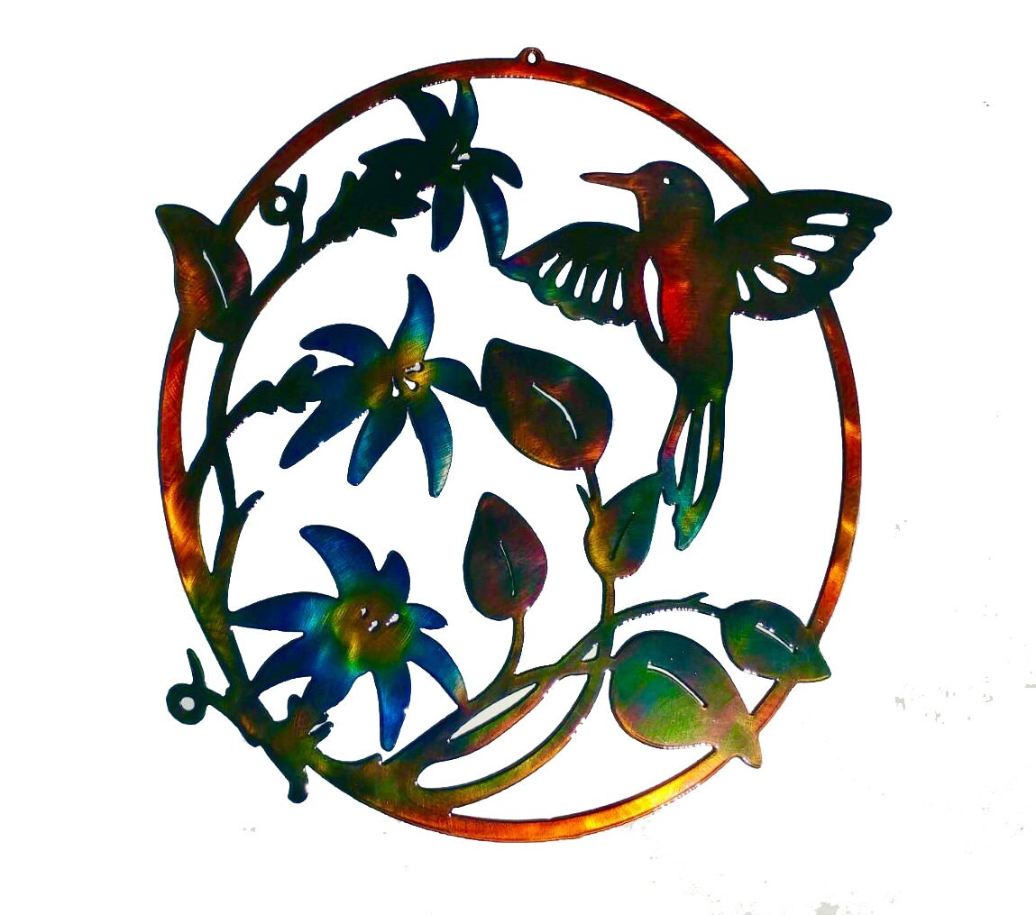 A circular metal wall art featuring a hummingbird feeding on flowers, with a multi-colored patina finish.