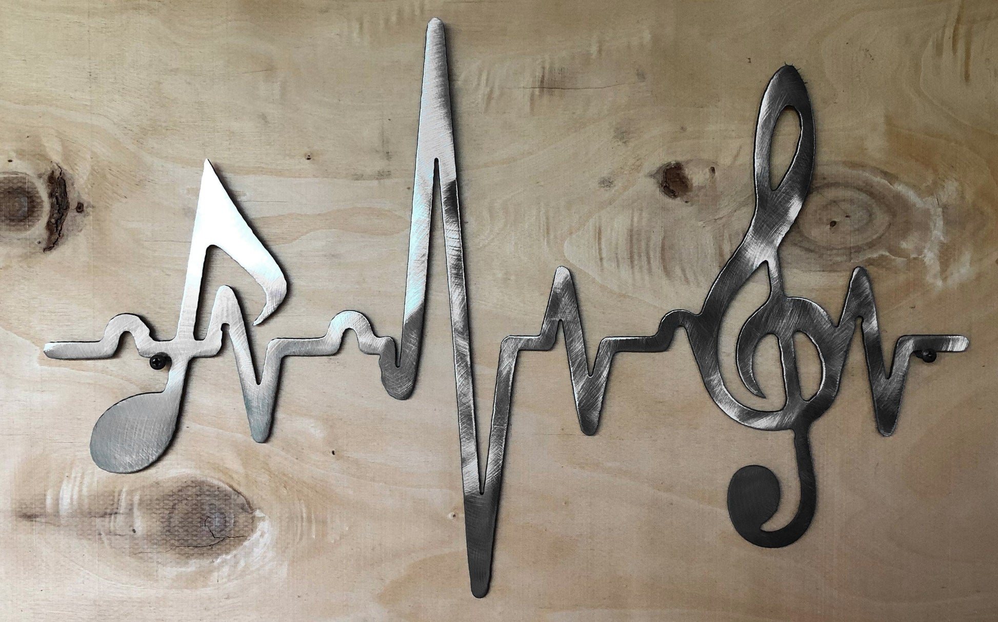 Unfinished EKG treble clef music note metal wall art