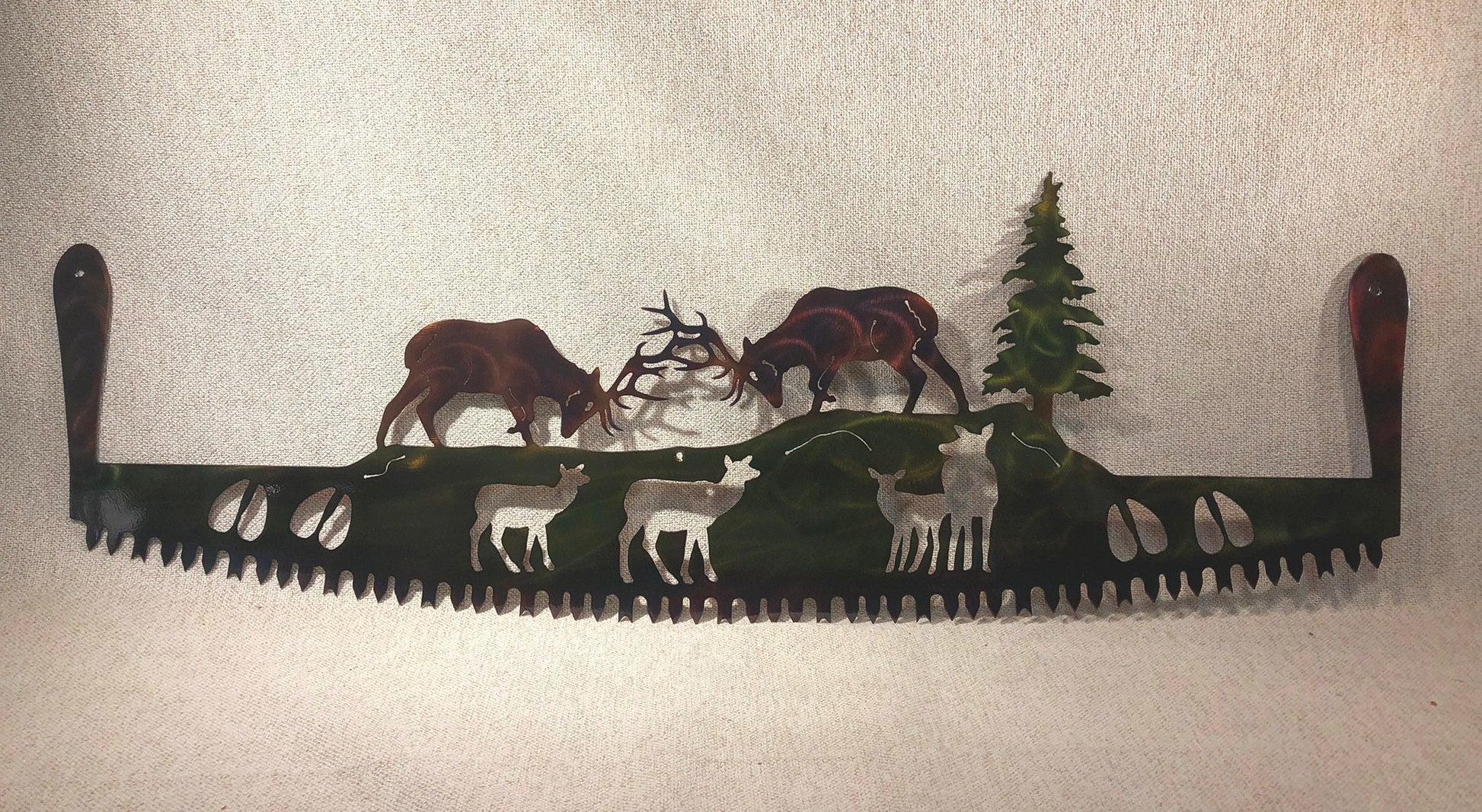Two-man crosscut saw metal art with fighting elk and handles