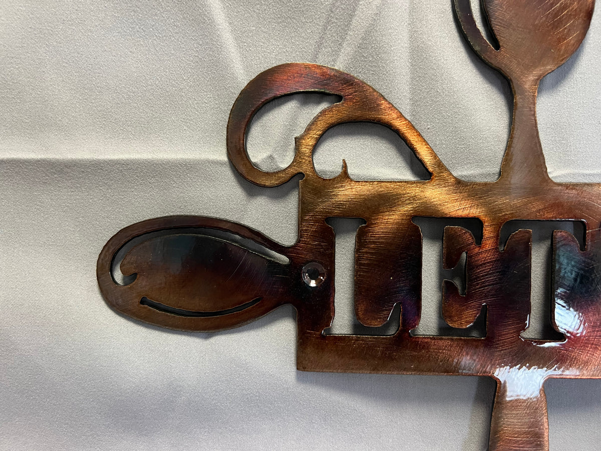 Plasma cut Let’s Eat metal kitchen decor made from steel