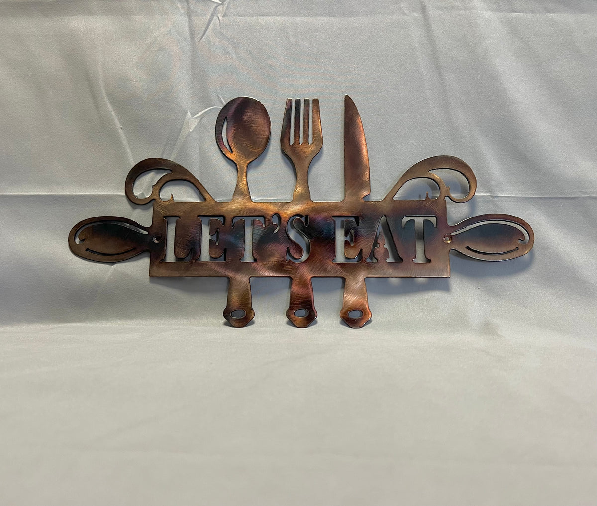 Handmade steel Let’s Eat wall decor with kitchen utensil design