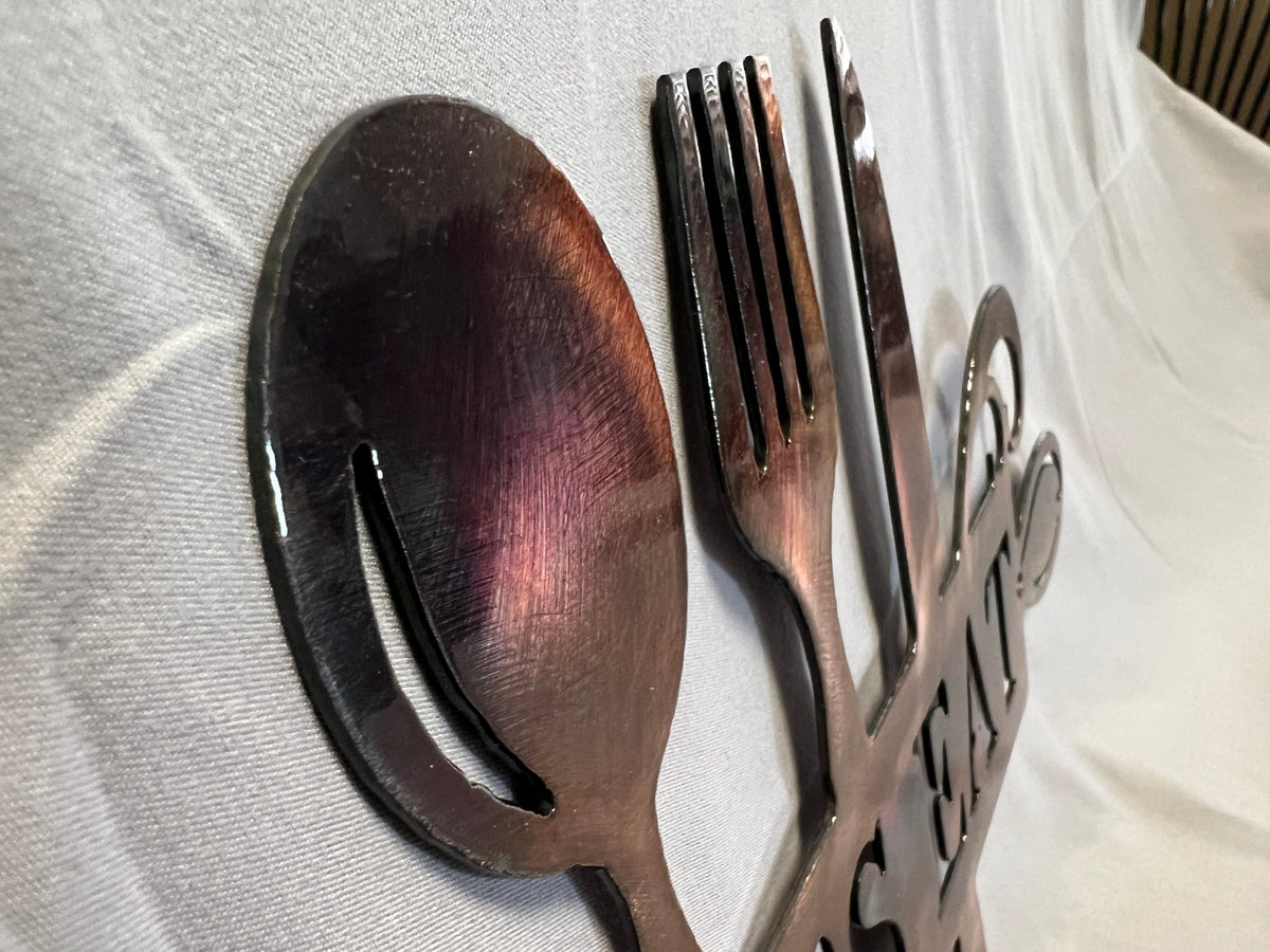 Metal kitchen wall decor featuring Let’s Eat and utensil silhouettes