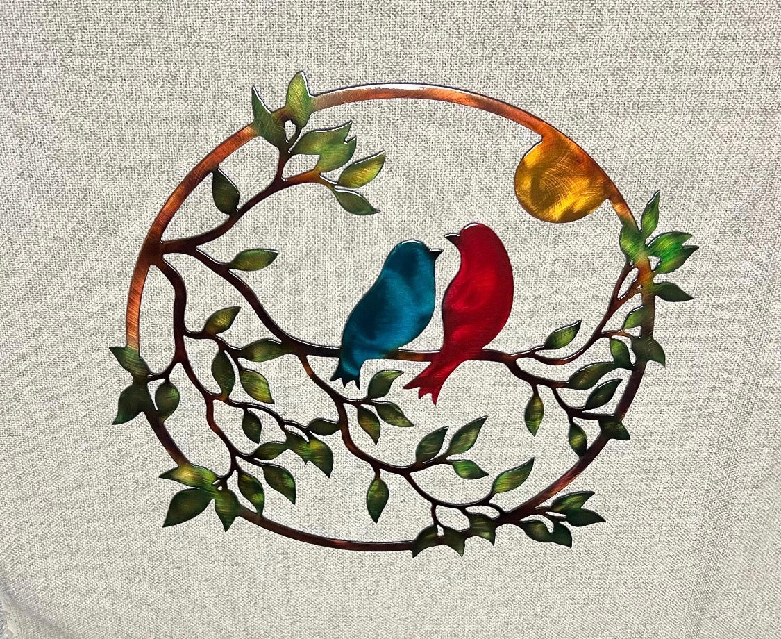 Close view of love birds steel wall art showing blue and red birds with hand-finished multicolor patina.