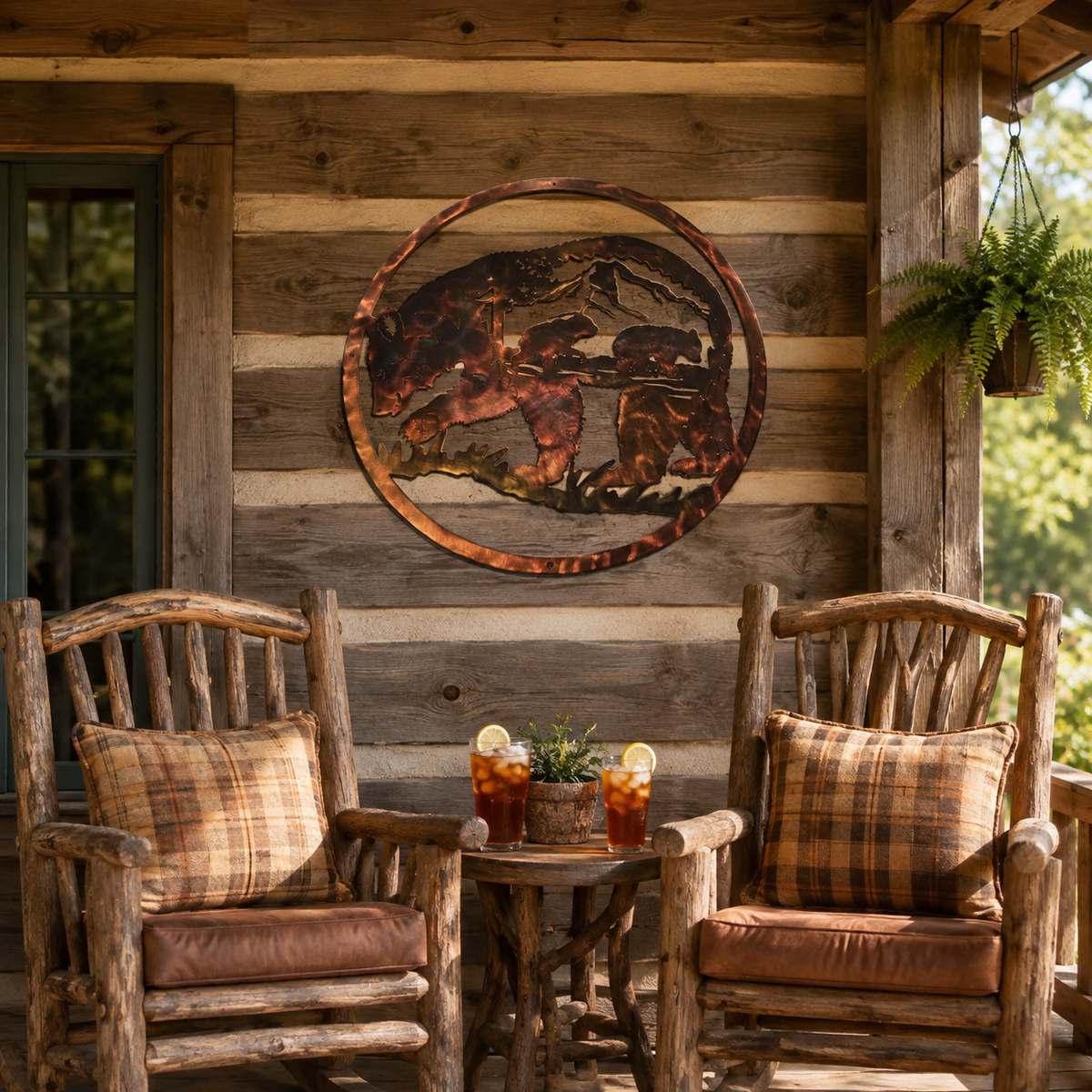 Mama bear and cubs metal wall art displayed on a rustic cabin porch above two chairs and an iced tea table