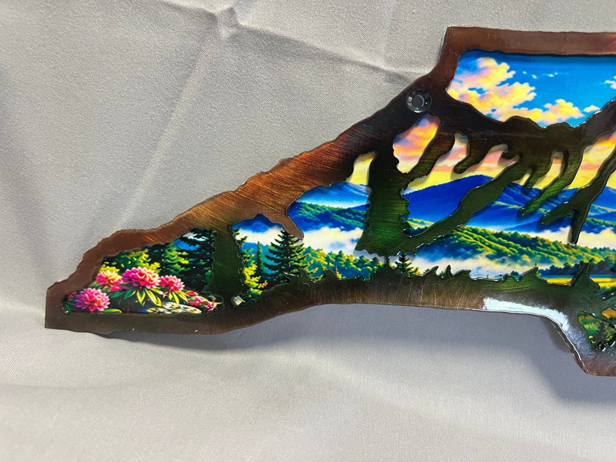 North Carolina layered metal wall art with UV-printed mountain-to-coast sunrise scene and hand-finished steel foreground.