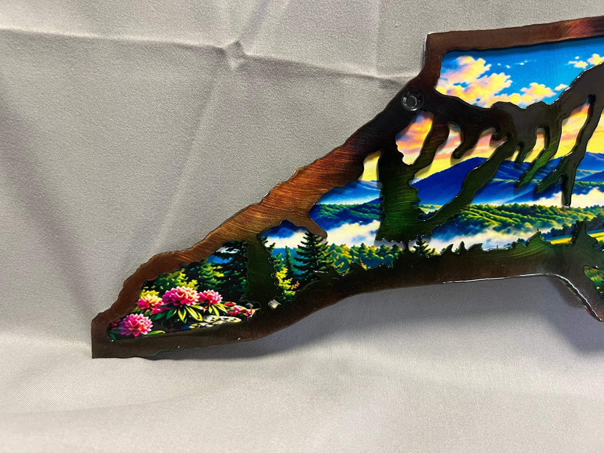 North Carolina layered metal wall art with UV-printed mountain-to-coast sunrise scene and hand-finished steel foreground.