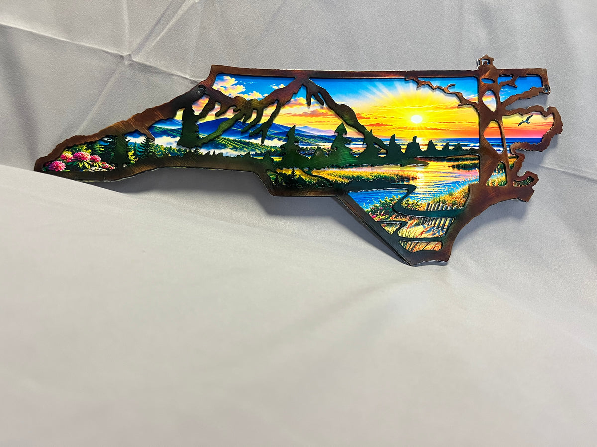 North Carolina layered metal wall art with UV-printed mountain-to-coast sunrise scene and hand-finished steel foreground.