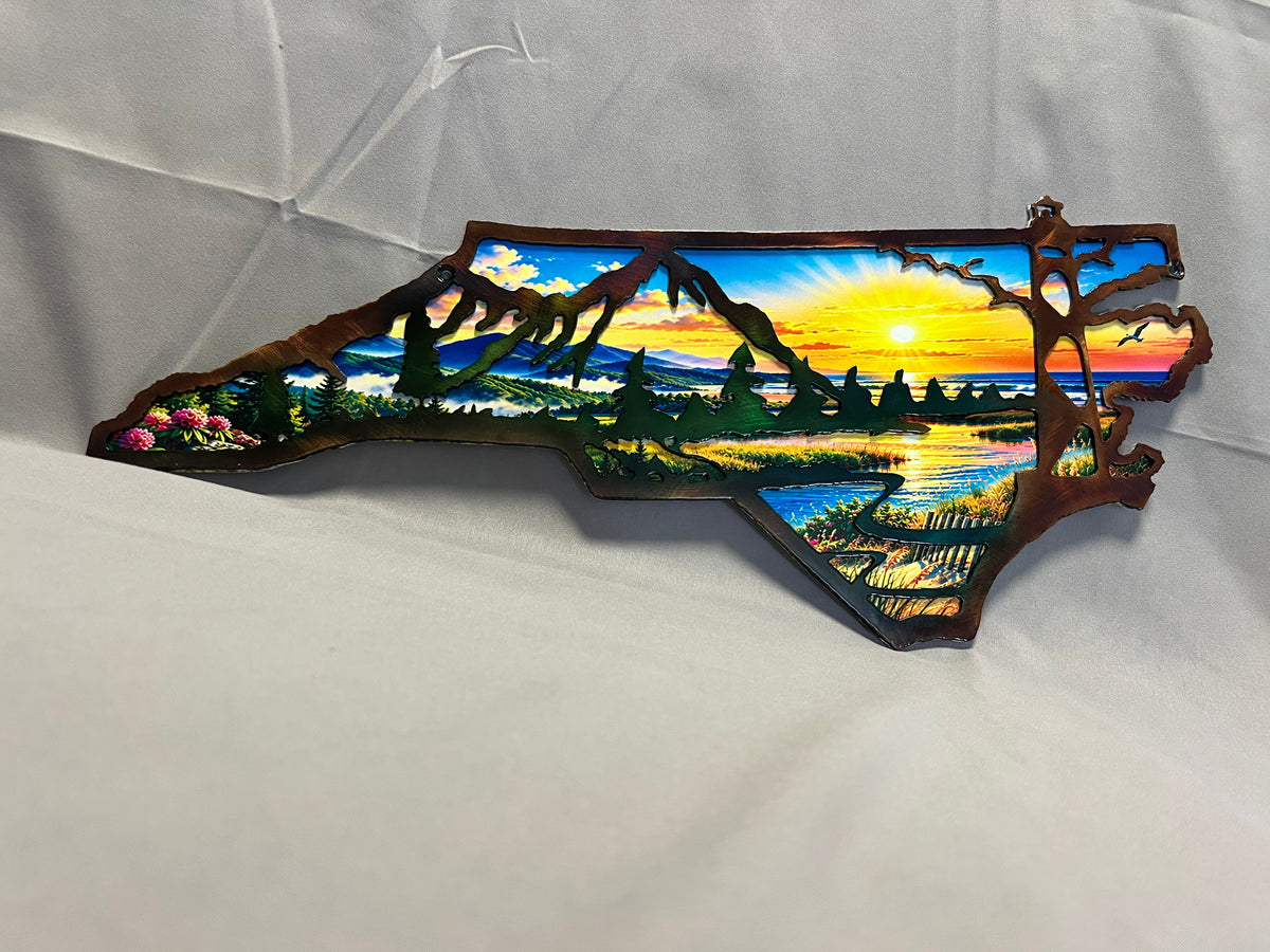 North Carolina layered metal wall art with UV-printed mountain-to-coast sunrise scene and hand-finished steel foreground.