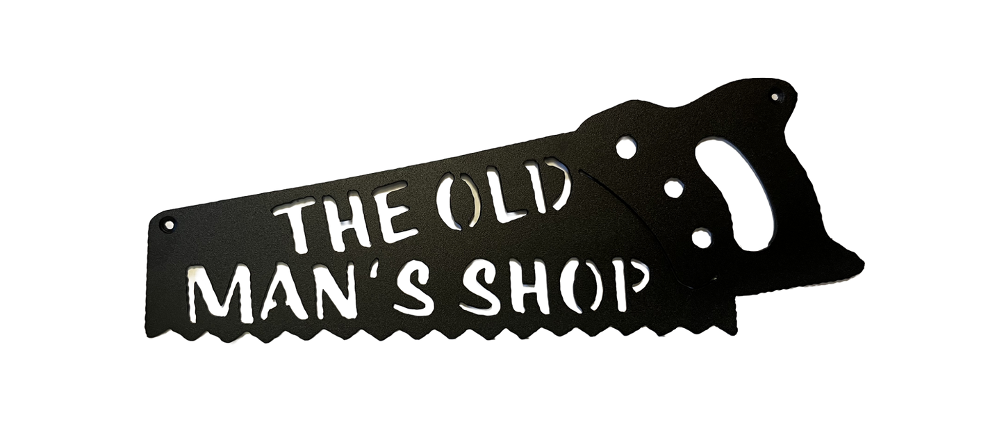 Black metal Old Man's Shop handsaw wall sign shown on a dark background