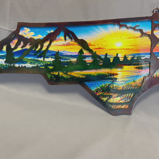 Video showing North Carolina layered metal wall art with a UV-printed mountain-to-coast sunrise scene.