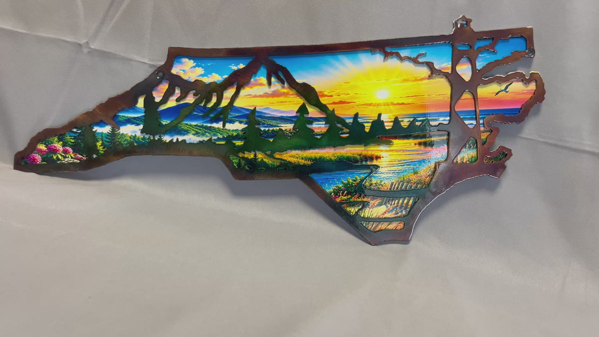 Video showing North Carolina layered metal wall art with a UV-printed mountain-to-coast sunrise scene.