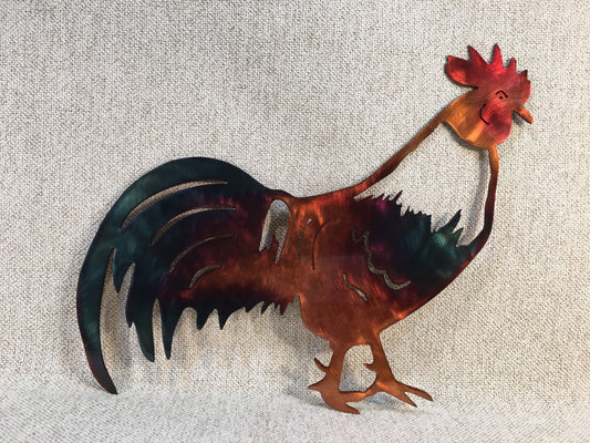 A wall-mounted metal art depiction of a rooster with a copper and patina finish, featuring airbrushed alcohol dye highlights.